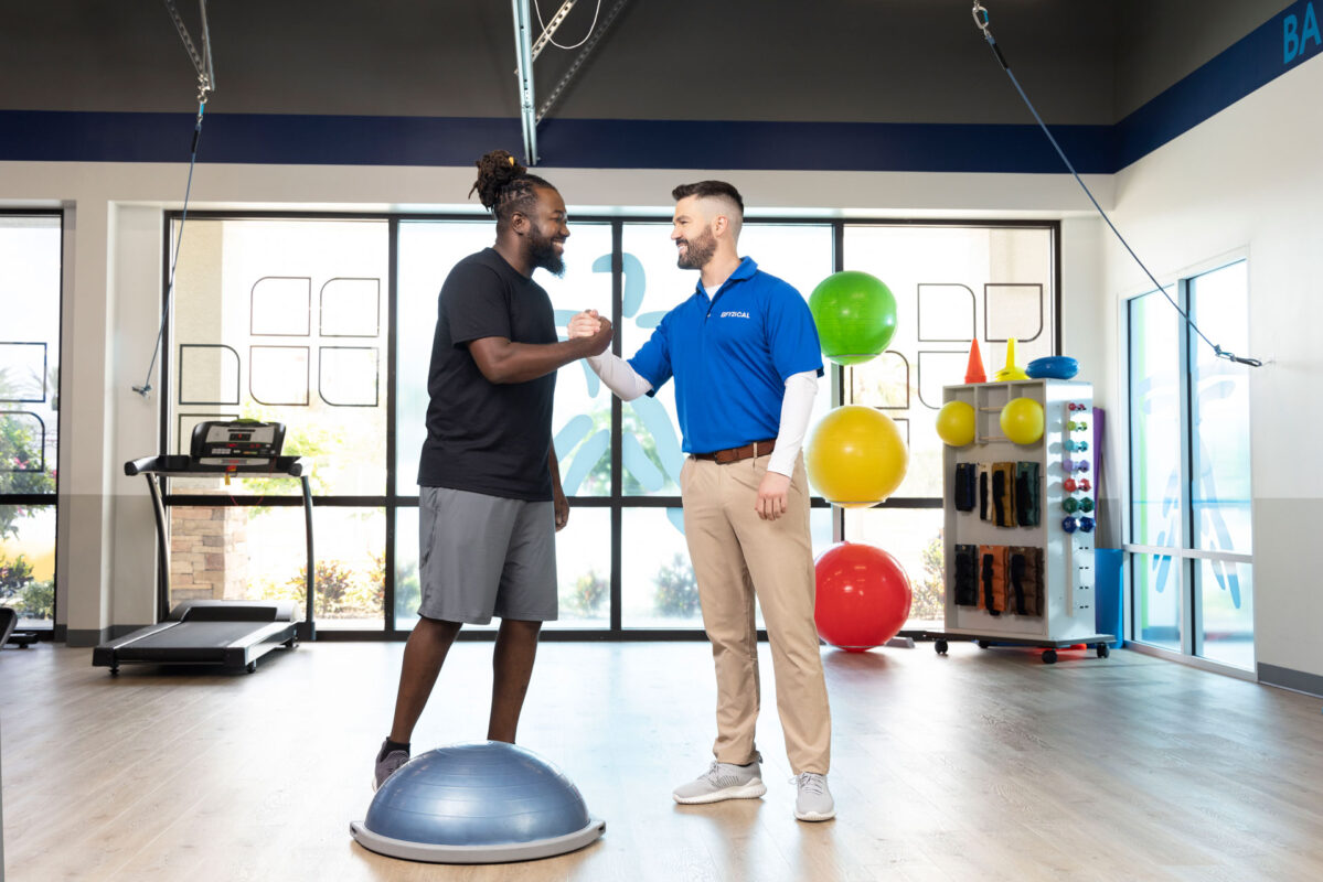 sports Injury orthopedic physical therapy therapist working with bosu ball